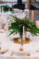 Guest table, with bouquet from petals and a number