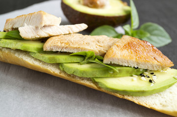 sandwich with avocado on wheat bread, with olive oil, Basil and sesame seeds