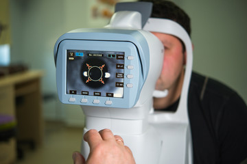 The ophthalmologist conducts the research with the help of various equipment, a contactless tonometer, for the diagnosis of eye disease