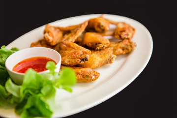 Fried chicken wings on white dish, Thai food