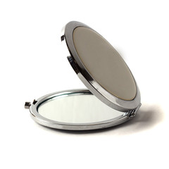 Pocket makeup mini mirror isolated on white