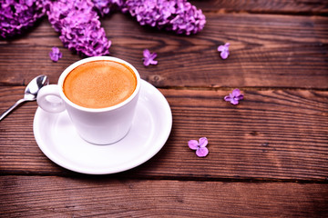 Espresso coffee in a white small cup and saucer