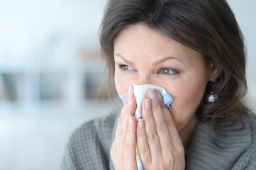 Cold young woman with a handkerchief