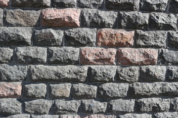 Rubble gray and brown rectangular stone wall, rubblework