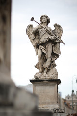 Angel with sponge statue on Ponte Sant Angelo bridge in Rome, Italy