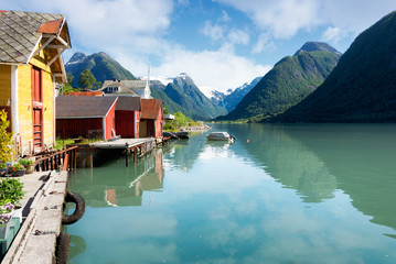 Fjord with colorful houses and mountains in Norway