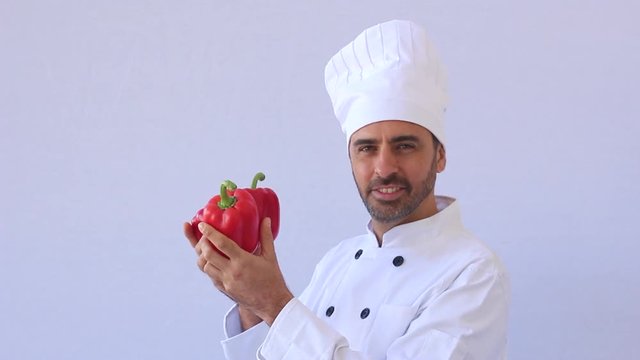 chef holding red pepers