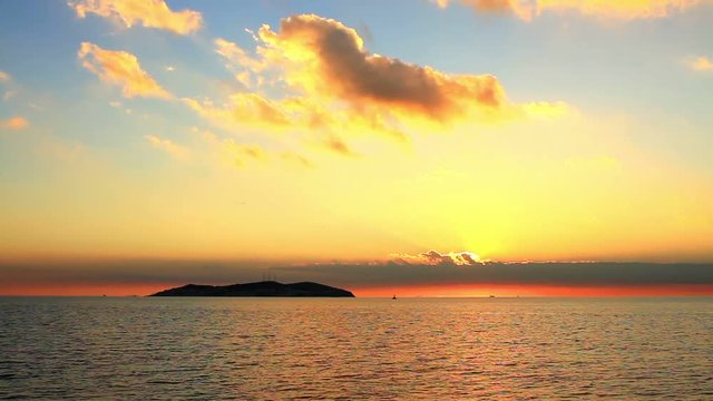 Marmara sea during sunset in Istanbul, Turkey. Static camera, 30 sec. 30 fps. A colorful sunset on Marmara Sea with the KINALI ADA view