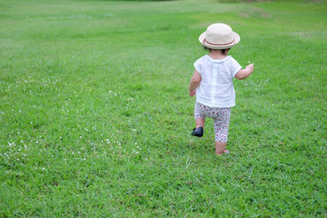 Cute Baby girl playing in the garden, close-up portrait, Portrait of a beautiful baby girl