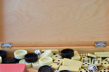 Obraz na płótnie Canvas Various board games chess board, playing cards, dominoes. Hobby. Metaphor for games and gambling.
