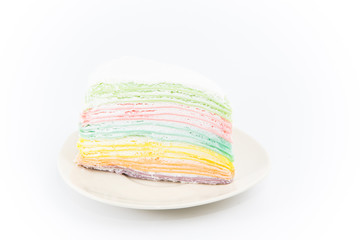 Rainbow crape cake on plate  isolated on white background