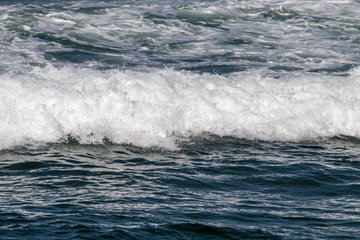 Close up Ocean Waves Breaking on Coastal Shoreline