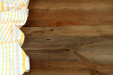 Dish cloth in yellow & white  brown wooden table