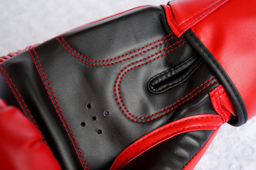 Red boxing gloves inside with vent hole close up detail.