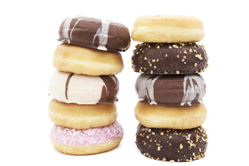 donuts stacked varied on white background