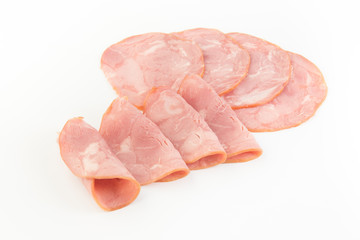 Fresh sliced smoked ham isolated on white background