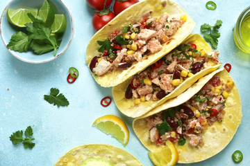 Assortment of chicken tacos - traditional dish of mexican cuisine.Top view.