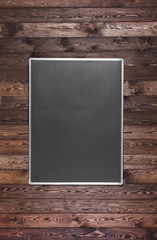 Black frame on a wooden wall, blackboard