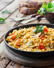 Tofu scrambled with mushrooms and tomatoes