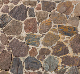 Texture of a wall with cobblestones and mortar