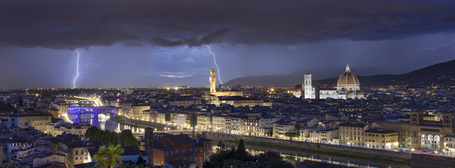 panorama with night flashes above the Florence in Italy