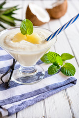 Delicious smoothie made of pineapple and coconut milk
