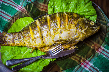 Baked carp with lemon