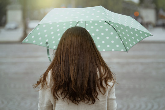 Fototapeta Woman with umbrella in Paris