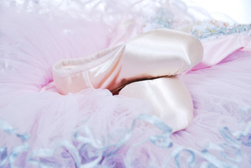 Fototapeta na wymiar New ballet slippers for classical dance with tulle dress