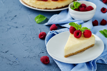 Cheesecake with fresh raspberries and mint