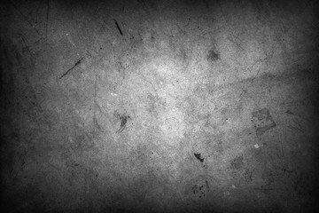 Grey grunge textured concrete wall background. Dark edges