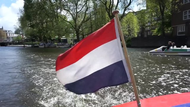 Amsterdam, dutch flag on a canal boat