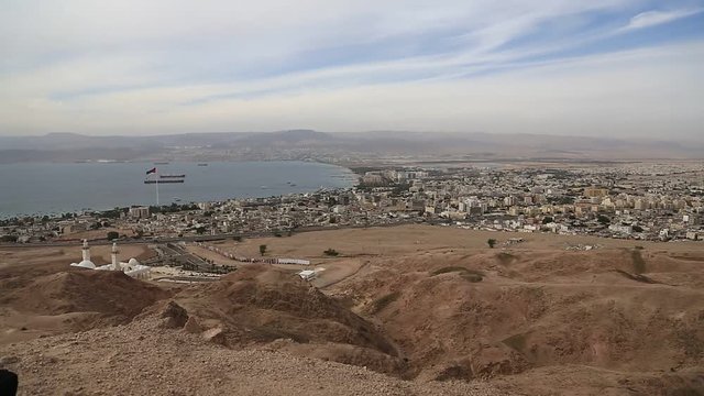 Panorama of Aqaba city in Jordan and Eilat city in Israel. View from mountain in Aqaba city in Jordan. Two city and two country in one video clip