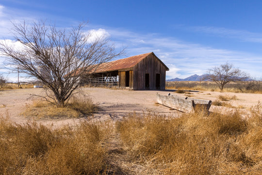 Abandoned  Barn and Water Trough in Desert - Powered by Adobe