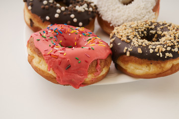 donuts on a plate on a white background