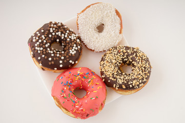 donuts on a plate on a white background