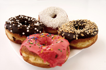 donuts on a plate on a white background