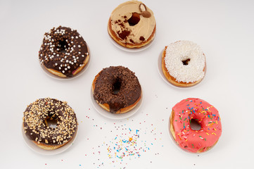 donuts on a plate on a white background