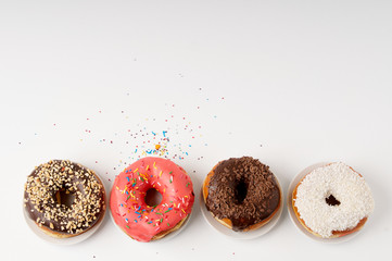 donuts on a plate on a white background