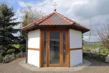 Entrance of a catholic chapel in Bavaria - obrazy, fototapety, plakaty