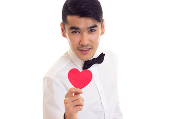 Young man holding a read heart 