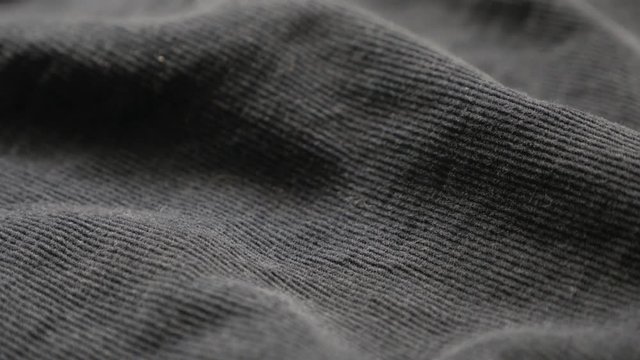 Tilting over indigo color cotton corduroy fabric texture 4K 3840X2160 UltraHD footage - Close-up of dark blue fine velvet material pattern slow tilt 2160p 30fps UHD video 