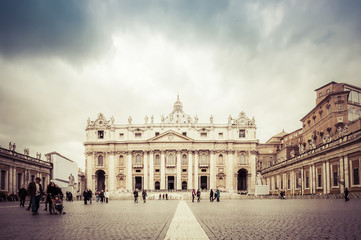 Fototapeta na wymiar VATICAN CITY, ROME, ITALY - NOV 28, 2011: St. Peter's square in the cloudy dramatic day. St. Peter's Square is a large plaza located directly in front of St. Peter's Basilica in the Vatican City