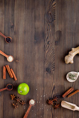 Dry colorful spices, cinnamon on kitchen wooden table background top view mockup