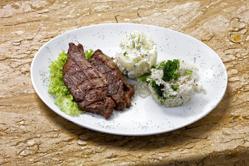 Grilled meat with trimmings