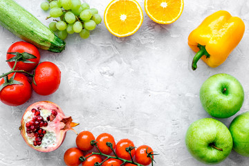 fresh vegetables and fruits for fitness dinner on stone background top view mockup