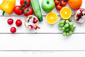 fresh vegetables and fruits for fitness dinner on white background top view mockup