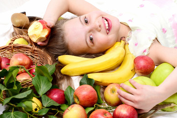 Fototapeta na wymiar exotic fruit or summer background with small happy girl