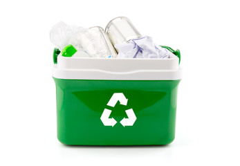 A recycle bin with plastic bottles, paper and other plastic items isolated on white background.