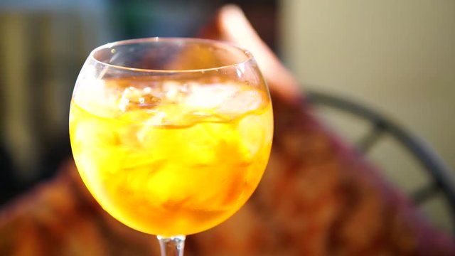 Iced spritz cocktail on a hot day, 4K